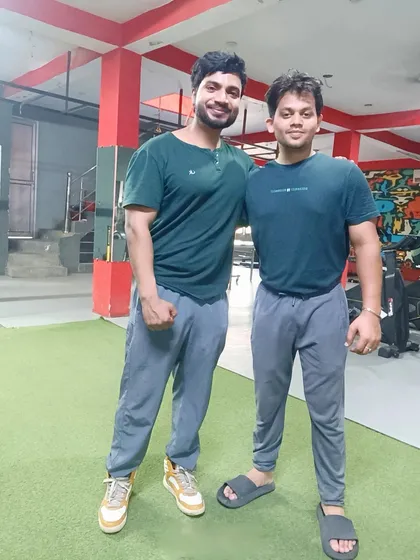 Posing with a client who has shown great improvement in his strength and physique. We work as a team to achieve these results.