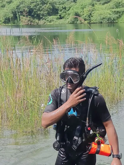 A final check of my mask and snorkel before heading into the water. Proper gear fit and function is a critical part of my pre-dive safety routine, a habit I instill in every diver I train.