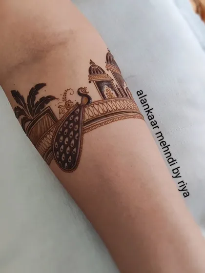 A bridal startup design featuring a peacock next to a palm tree and palace architecture.
