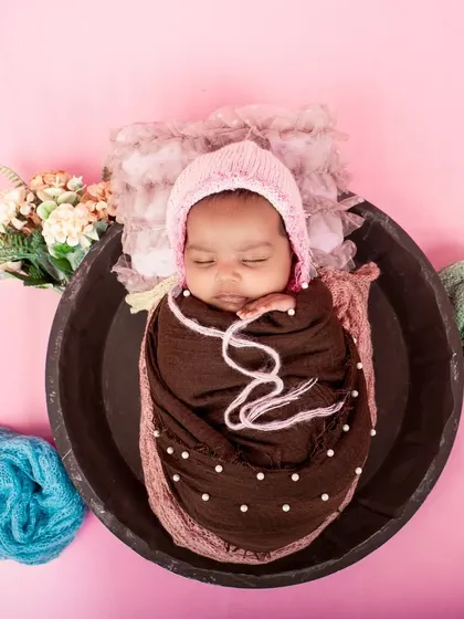 A cozy and colorful newborn setup. I use a variety of soft wraps and textures to keep the baby comfortable and create visually interesting photos.