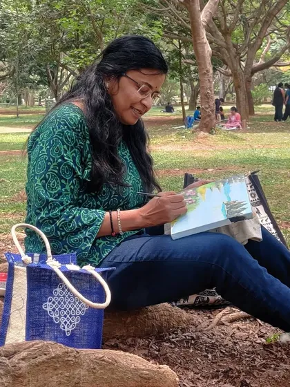 Painting live at Cubbon Park, with my trusty supplies and my kolam-design bag.