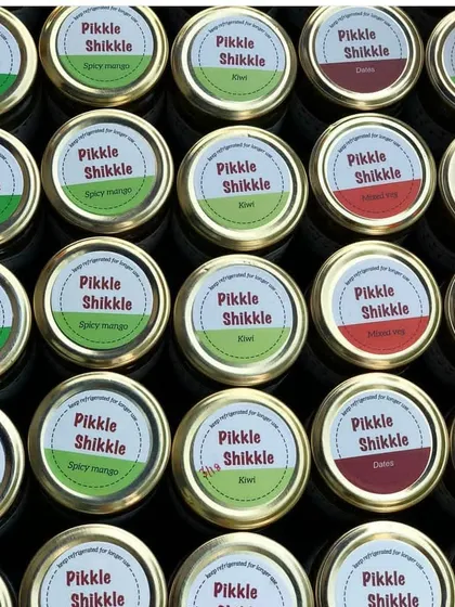 An overhead shot of our colourful pickle lids, showing the variety we offer.