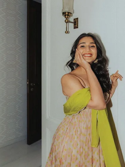 A happy client in a beautiful printed anarkali. Her smile says it all, capturing the effortless joy of our festive wear.