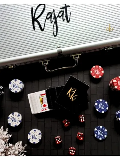 This poker set was personalized for "Rajat," with his name on the case and his initials "RK" on the chips and card boxes.