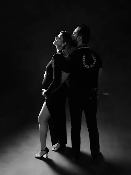 When love grows, it glows. This dramatic black and white shot uses light and shadow to create a powerful, artistic portrait of a couple expecting.