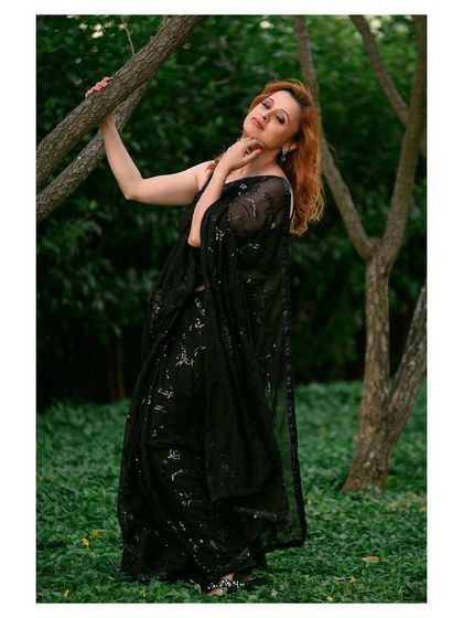 A different pose from the same outdoor shoot, capturing the model interacting with the environment, which adds a story to the image.