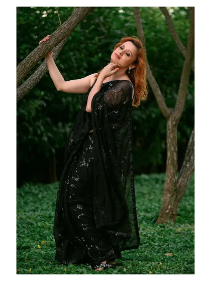 A different pose from the same outdoor shoot, capturing the model interacting with the environment, which adds a story to the image.