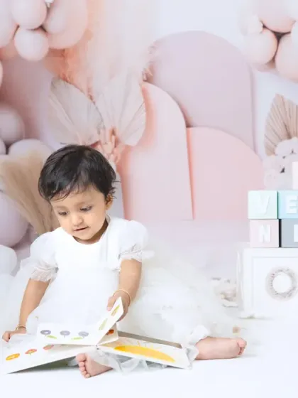 A happy family celebrating their daughter's first birthday. I always encourage parents to jump in for a few shots during milestone sessions.