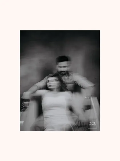 An experimental black and white photo using motion blur. This artistic technique creates a dreamy, ethereal feeling, capturing the whirlwind of emotions.