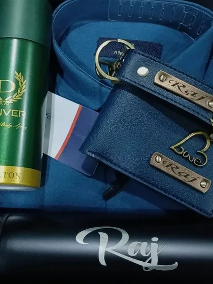 This blue-themed hamper includes a personalized temperature bottle, a matching wallet and keychain set with 'Love' and scooter charms, a shirt, and deodorant.