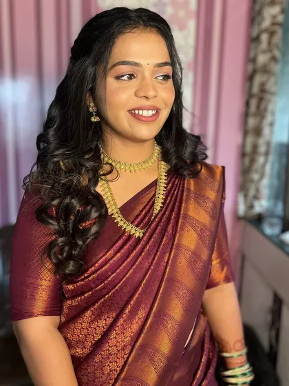 The perfect minimal look for an engagement ceremony. Her skin is glowing, and the makeup feels light and fresh, allowing her happy smile to be the focus.