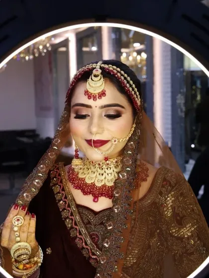 Using a ring light for that perfect final shot. This image shows how my HD makeup looks under professional lighting, ensuring a smooth, non-cakey, and radiant finish.