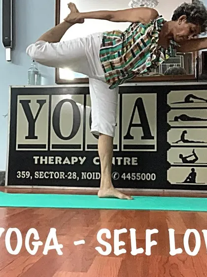 A variation of Dancer's Pose, showing the balance and flexibility required. It's a joyful and heart-opening posture.
