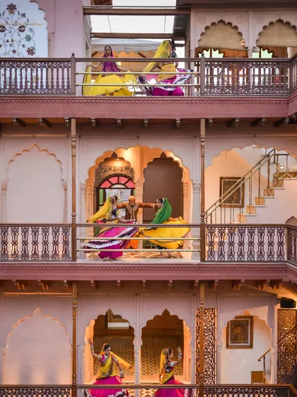 The multi-level balconies of Haveli Dharampura provide a stunning vertical stage for cultural performances. The architecture itself becomes part of the spectacle, allowing for a dynamic and immersive experience for all guests.