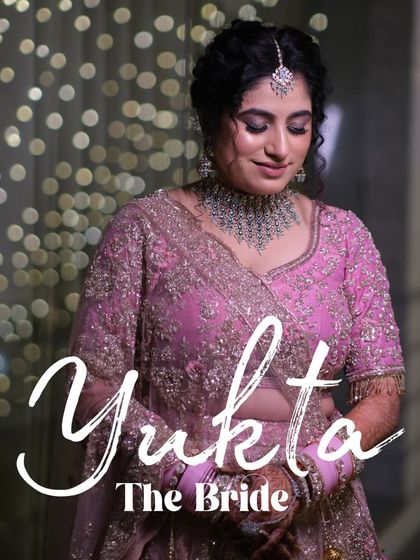 A beautiful portrait of the bride, Yukta, capturing her gentle smile and the intricate details of her wedding attire.