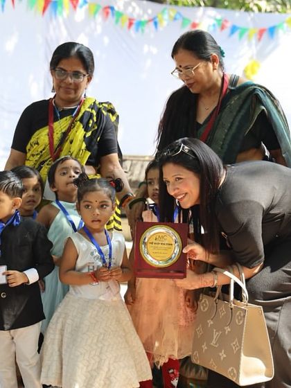 A moment of recognition at the Bal Utsav, where young winners of our competitions are honored with an award. We celebrate every child's creative efforts.