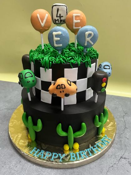 A fun, car-themed birthday cake perfect for a little one's celebration. I used cake pops as toppers to create a playful and unique design.