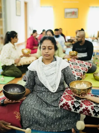 In my training, learning is a shared experience. Here, students practice singing bowl techniques on one another, feeling the vibrations and understanding the healing process from both sides.