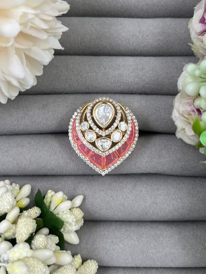 Our leaf-shaped adjustable rings, featuring a large central Moissanite stone surrounded by American Diamonds. These are available in green, red, and pink Meenakari finishes.