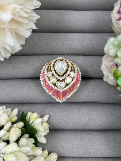 A close-up of the pink leaf-shaped ring.