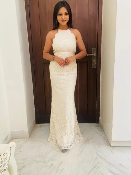My collection also includes elegant Western wear like this white lace halter-neck gown. It's a sophisticated choice for cocktail events, formal dinners, or even a modern pre-wedding shoot.
