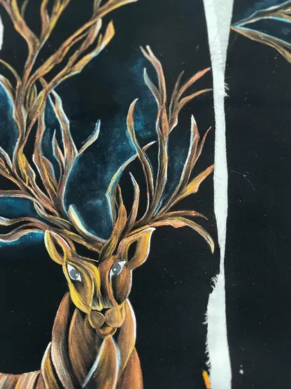 A close-up of the deer's face on the velvet tuxedo. Capturing the gentle expression in its eyes was an important part of bringing this piece to life.