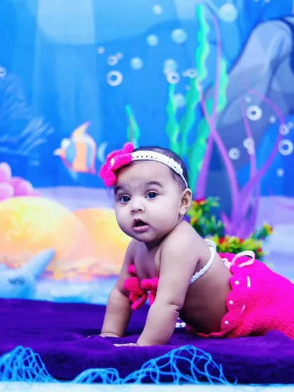 This little mermaid is on the move, crawling across the "ocean floor" in our studio.