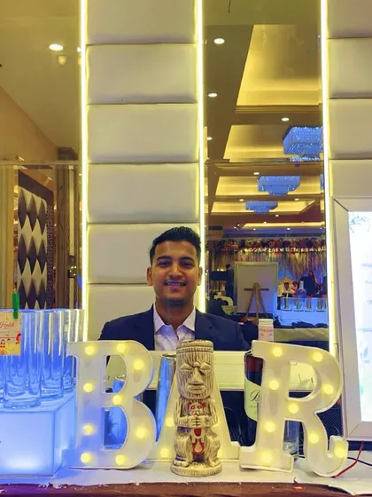 My setup for Prathamesh and Shruti's Maharashtrian Haldi ceremony. The illuminated 'BAR' sign and tiki-style glasses add a fun, modern twist to a traditional event.