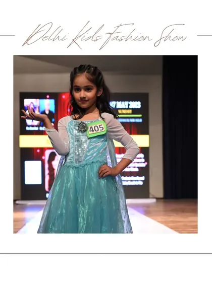 Dressed as a fairytale princess, this young model captivates the audience with her graceful pose. My events are a place where children's fashion dreams come to life.
