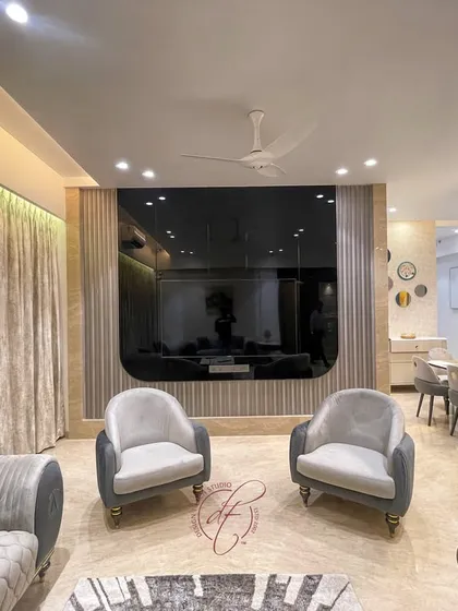 This view highlights the custom TV unit and the sleek, fluted paneling on the wall. The design shows how we integrate entertainment systems seamlessly into the overall aesthetic of the room.