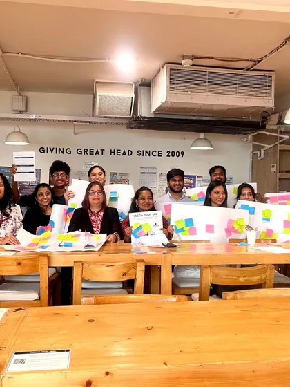 A group photo from our "Design Your Life for Happiness" workshop, where participants learned to apply design thinking principles to their own well-being.