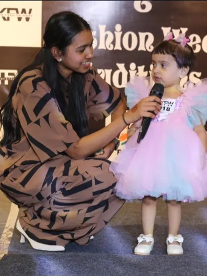 I believe talent has no age limit. Here I am with one of our youngest participants at the auditions. We make sure even our tiniest contestants feel comfortable and confident.