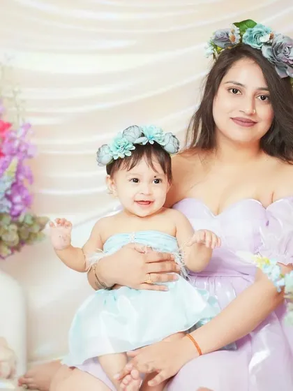 A beautiful portrait from our Mother's Day mini sessions, with mom and baby in coordinating floral headbands.
