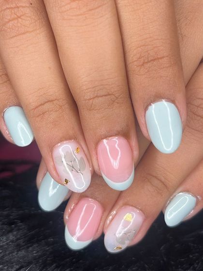 A full view of the soft pastel and floral decal manicure.