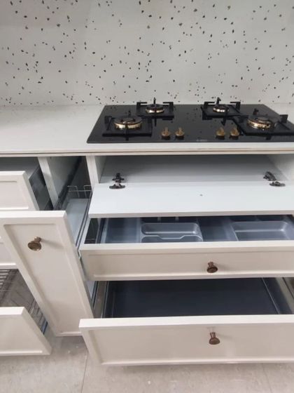 A duplicate of 71, providing a detailed look at the smart storage solutions like cutlery organizers and pull-out drawers.
