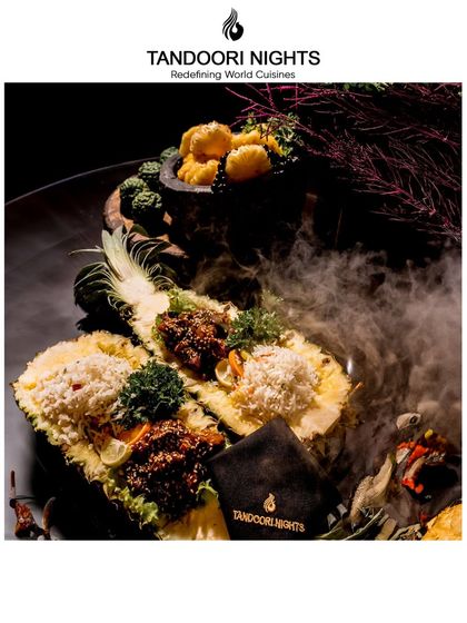 Step into a world of culinary elegance. This dramatic presentation features savory dishes served in a hollowed-out pineapple, complete with theatrical smoke for a touch of indulgence.