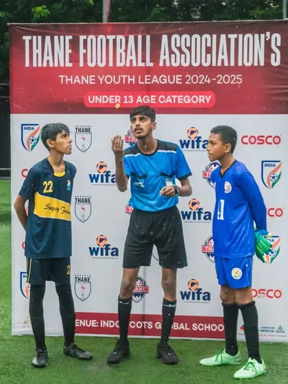 The captains' handshake before a U13 Thane Youth League match, embodying the spirit of sportsmanship.