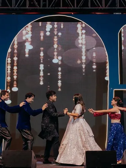A 'ladkevale vs ladkivale' performance where the couple gets caught in the middle. These playful moments create some of the best memories and photos from the sangeet night.