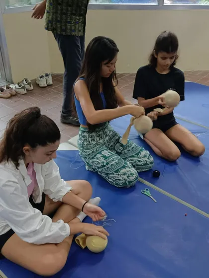 Students at the workshop in Bangladesh are busy creating their puppets. They are learning to work with fabric, thread, and other simple materials.