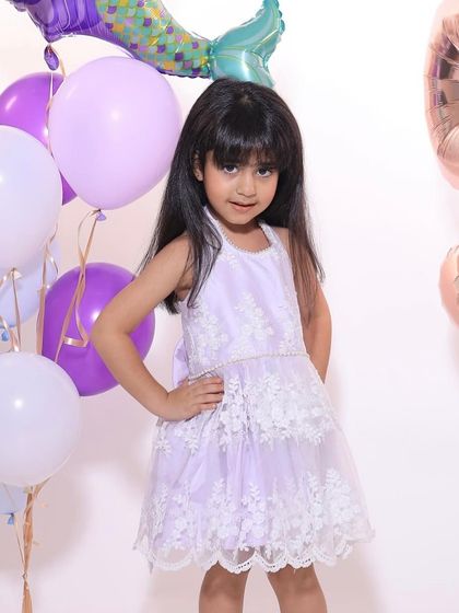 A beautiful client in our backless lilac lace dress. Customization is key, and I can tailor any design to be exactly what you and your little one envision.