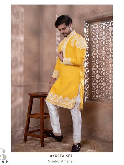 Our zesty yellow kurta, featuring beautiful white floral crewelwork on the shoulders, placket, and hem.