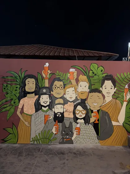 The final "cheers" mural, a perfect backdrop for a place where people gather and celebrate.