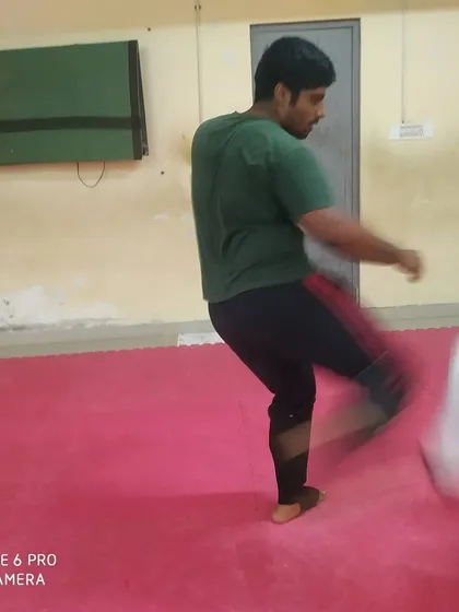 A blur of motion as two students exchange techniques. Speed is a critical element of effective kumite.