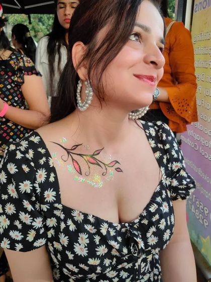 A delicate branch with leaves painted on the chest, accented with a touch of glitter.