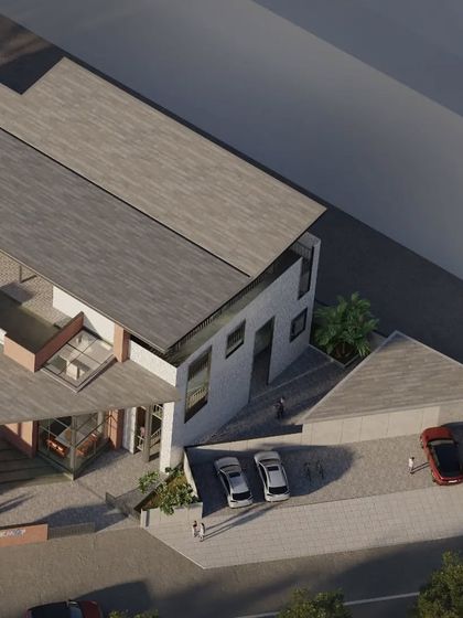 A closer aerial view of the KMYF Center highlights the building's relationship with its surroundings. The design carefully manages public access and private functions while maintaining a cohesive architectural identity.