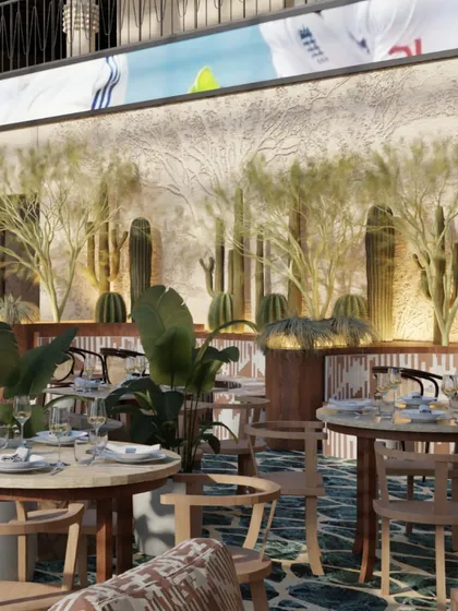 At Skyro, massive columns with Tiki-totem motifs are designed to light up like fireflies. The space is grounded by green rubble flooring, connecting guests to the essence of the earth.