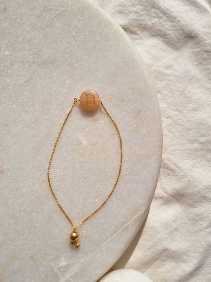 Another view of my initial embossed Peach Moonstone bracelet.