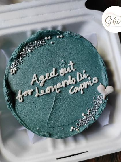 A birthday cake with a topical joke for a fan. This design, which reads "Aged out for Leonardo DiCaprio," is a great example of how we can incorporate pop culture humor into your cake.