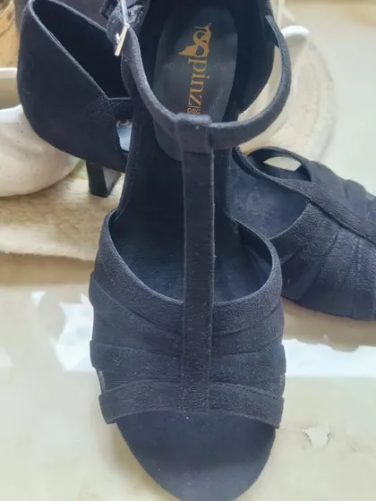 Here is a detailed look at our Classic Black suede heel. We focused on a design that offers both style and function, with a secure T-strap that keeps your foot in place during every step, spin, and turn on the dance floor.