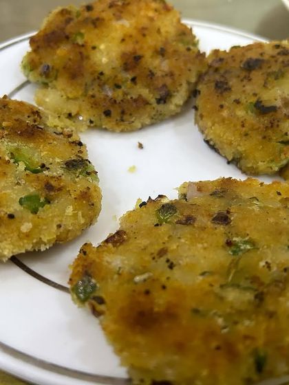 A close-up of the Poha cutlets, showing the texture and the vegetables inside.